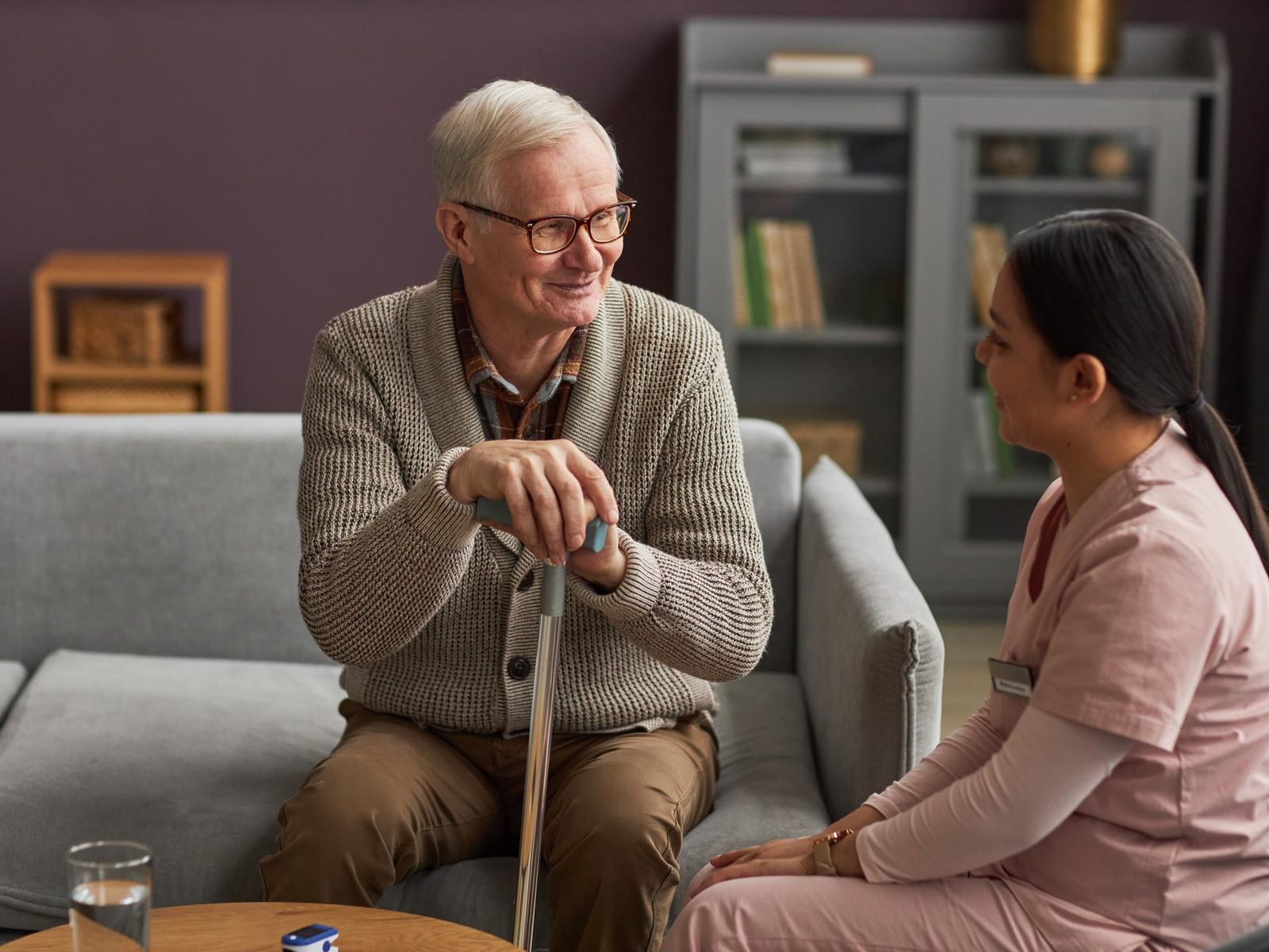 A care worker talking warmly with an older resident